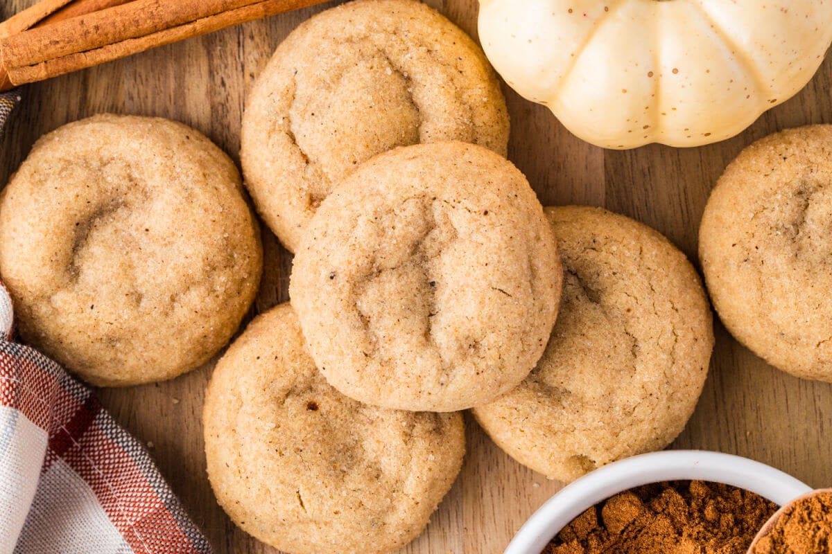 Pumpkin pie spice cookies on a wooden board.