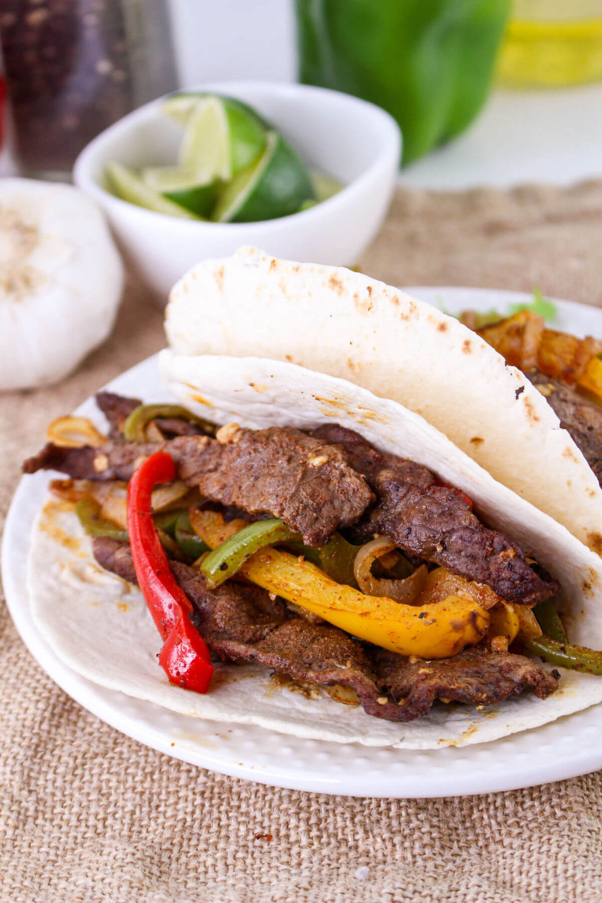 Sheet pan beef fajitas on a plate.