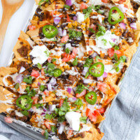 Sheet pan beef nachos on a baking sheet.