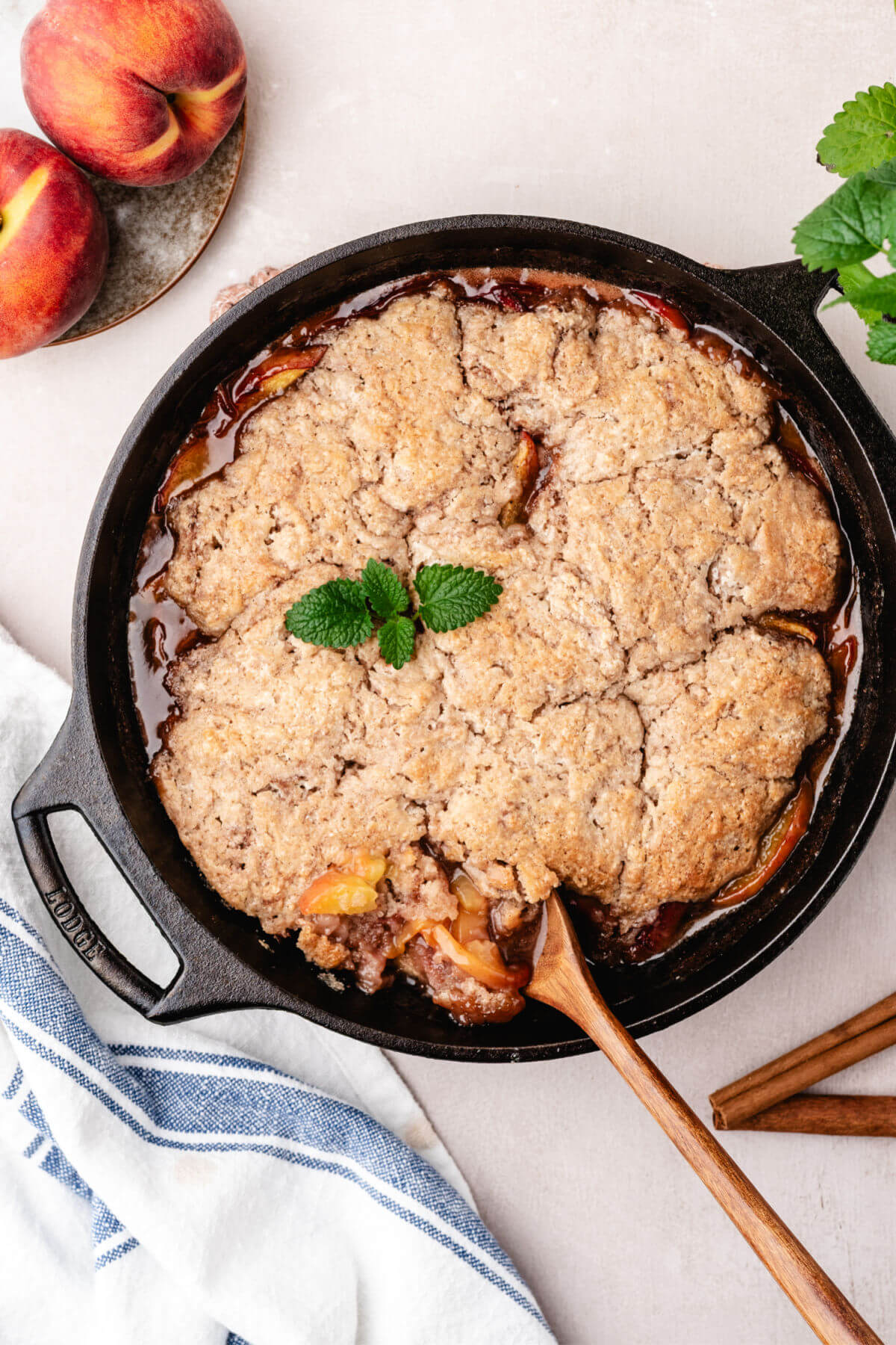 Skillet peach cobbler in a. cast iron skillet.