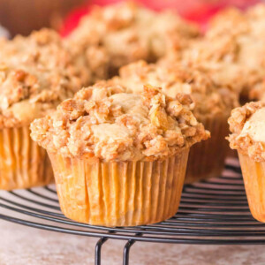 Sourdough apple muffins on a cooling rack.