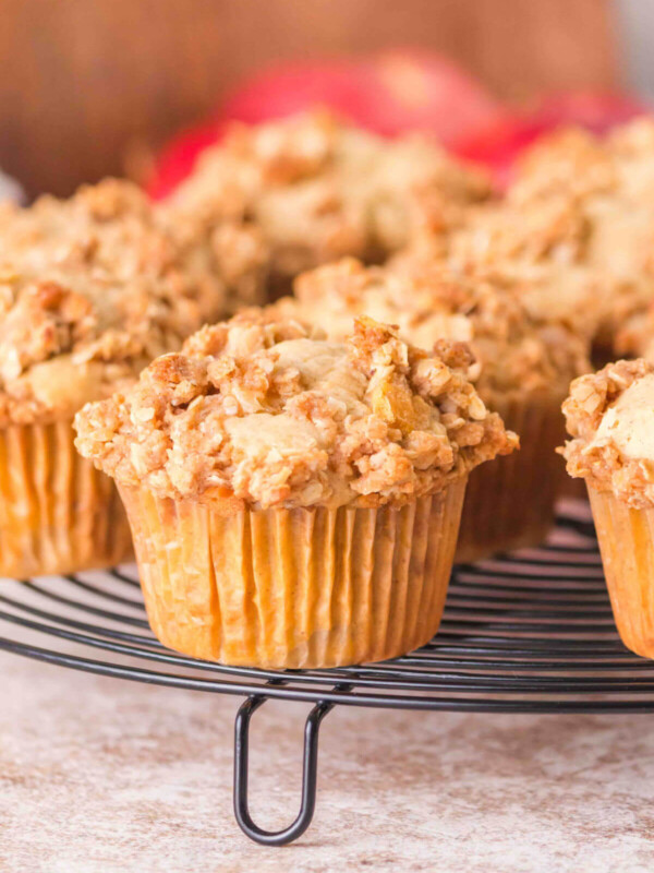 Sourdough apple muffins on a cooling rack.