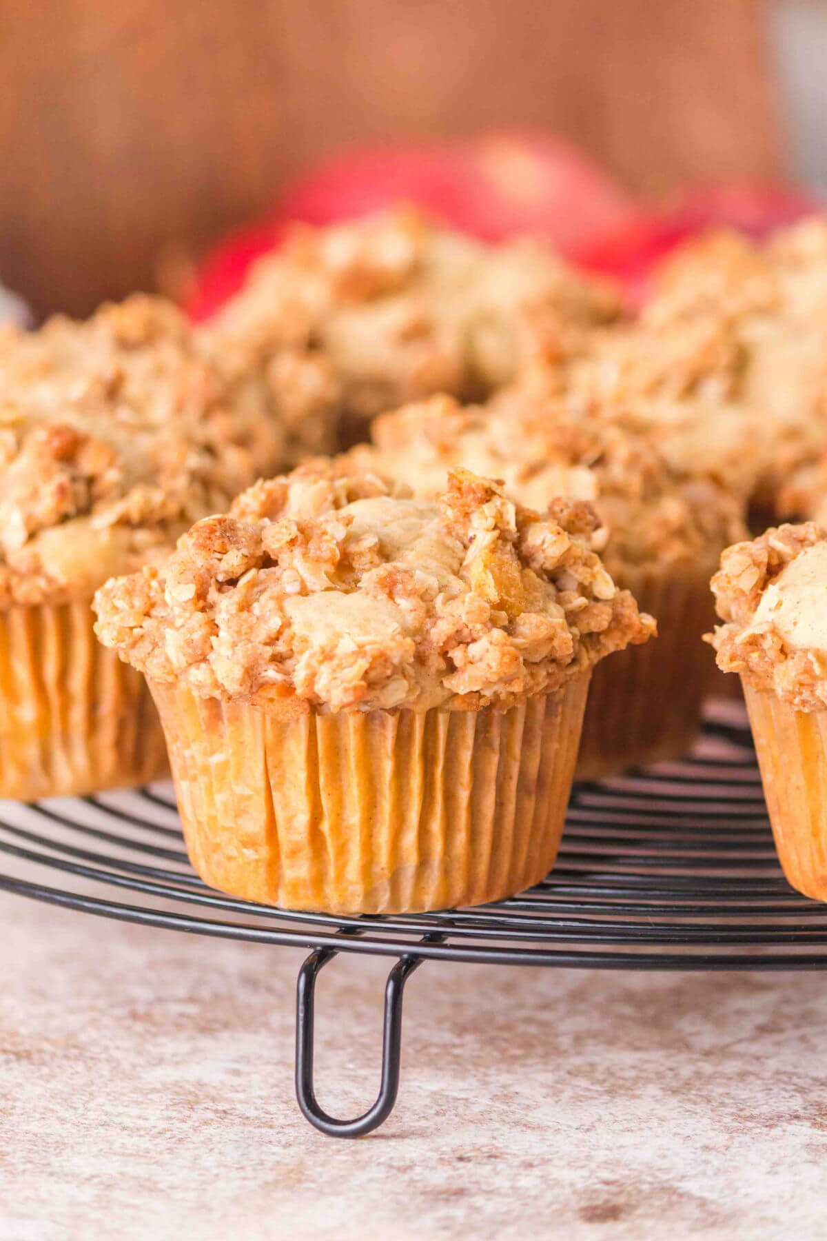 Sourdough apple muffins on a cooling rack.