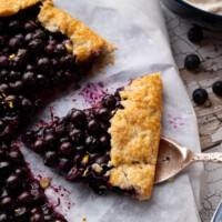 Blueberry sourdough galette with a slice cut out of it.
