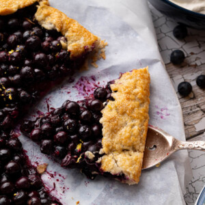 Blueberry sourdough galette with a slice cut out of it.