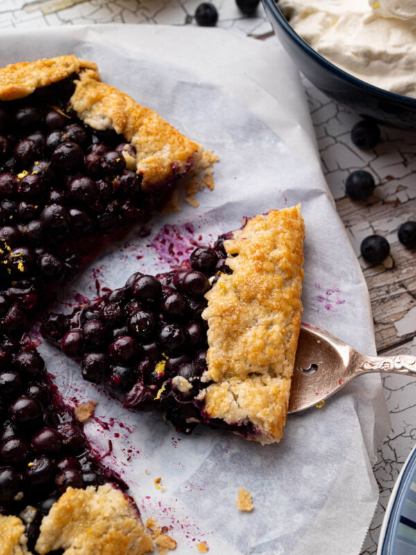 Blueberry sourdough galette with a slice cut out of it.