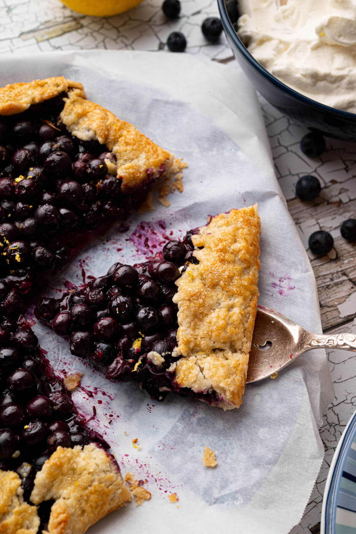 Blueberry sourdough galette with a slice cut out of it.