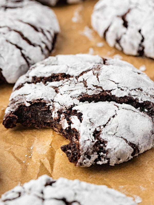 Sourdough chocolate crinkle cookies on parchment paper.