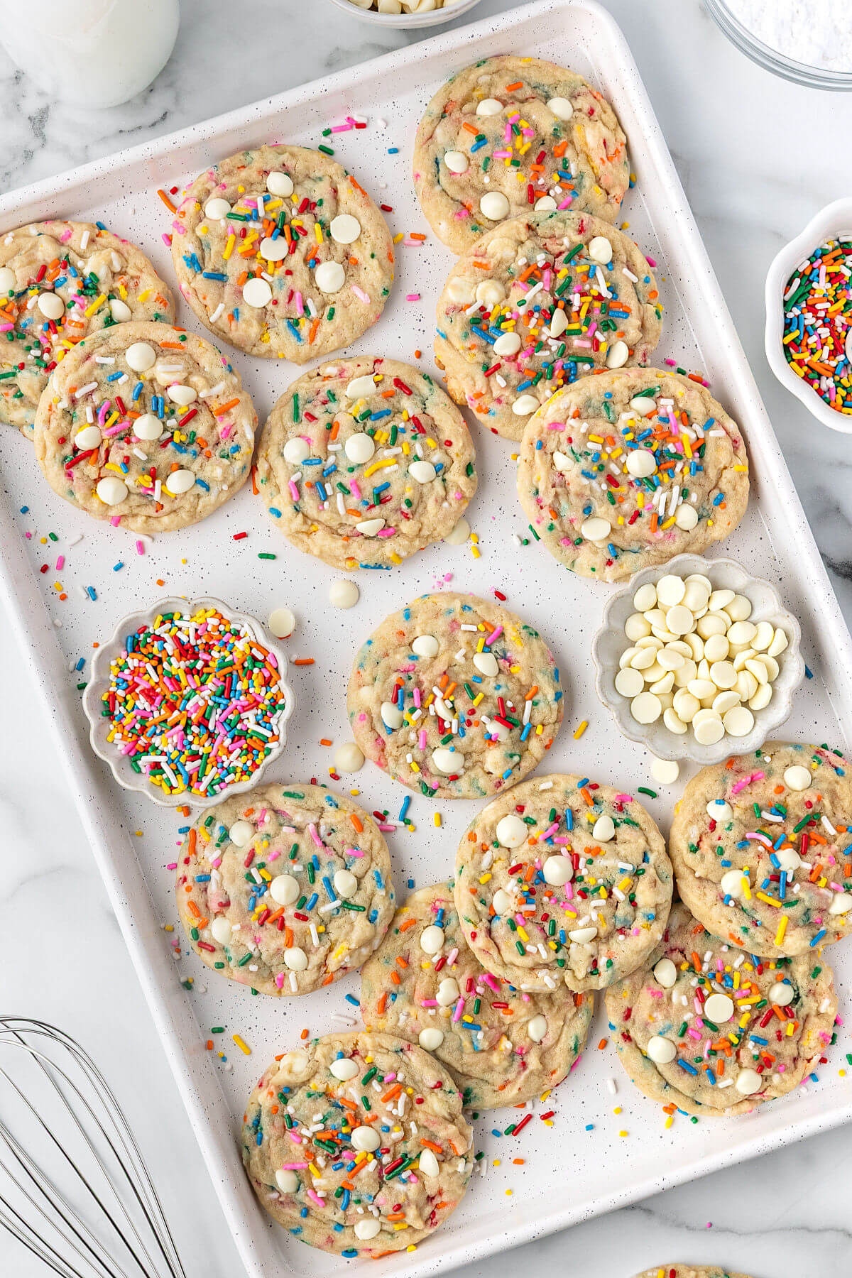 Sourdough Funfetti cookies on a baking sheet after baking.