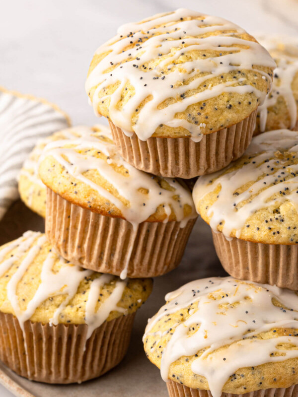 Sourdough lemon poppy seed muffins on a serving plate.