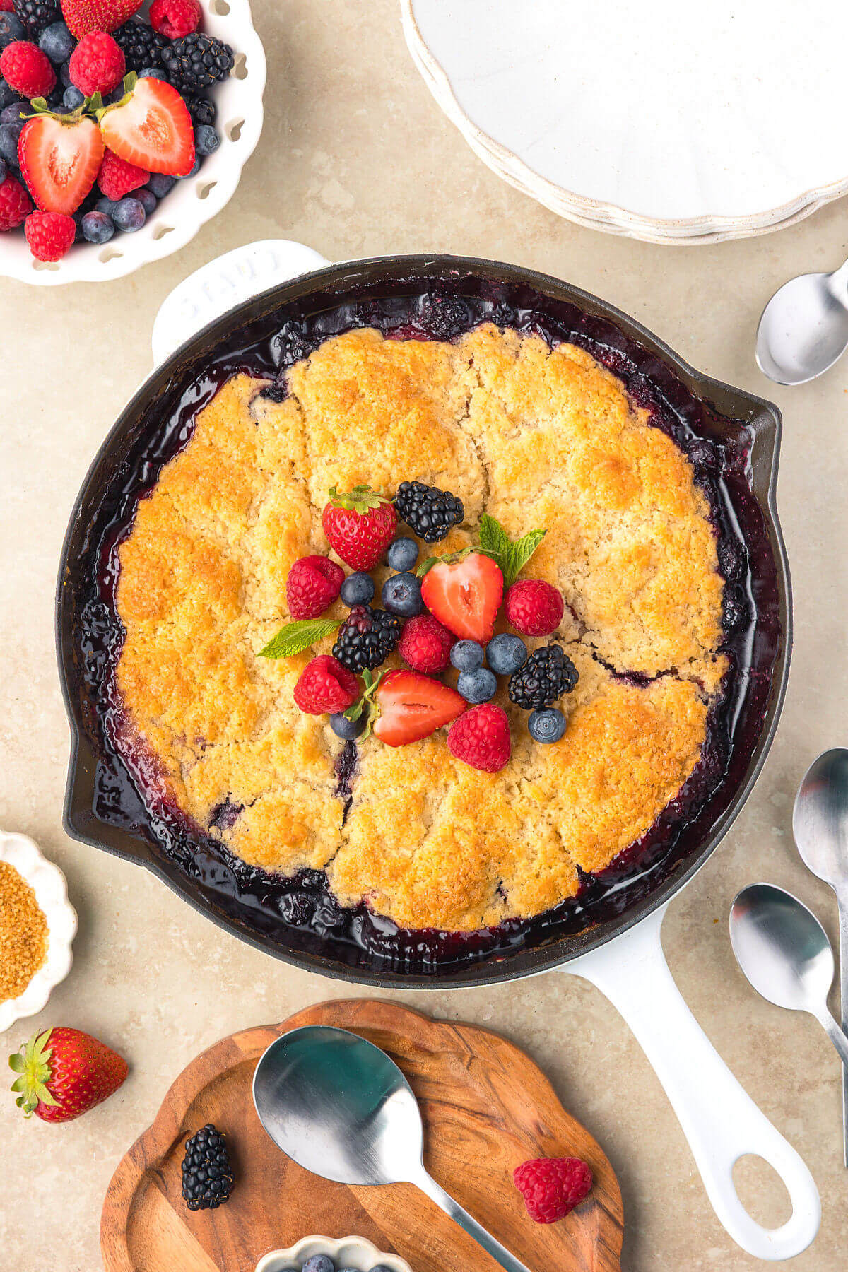 Sourdough mixed berry cobbler in a cast iron skillet after baking.