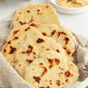 Sourdough naan in a bread basket.