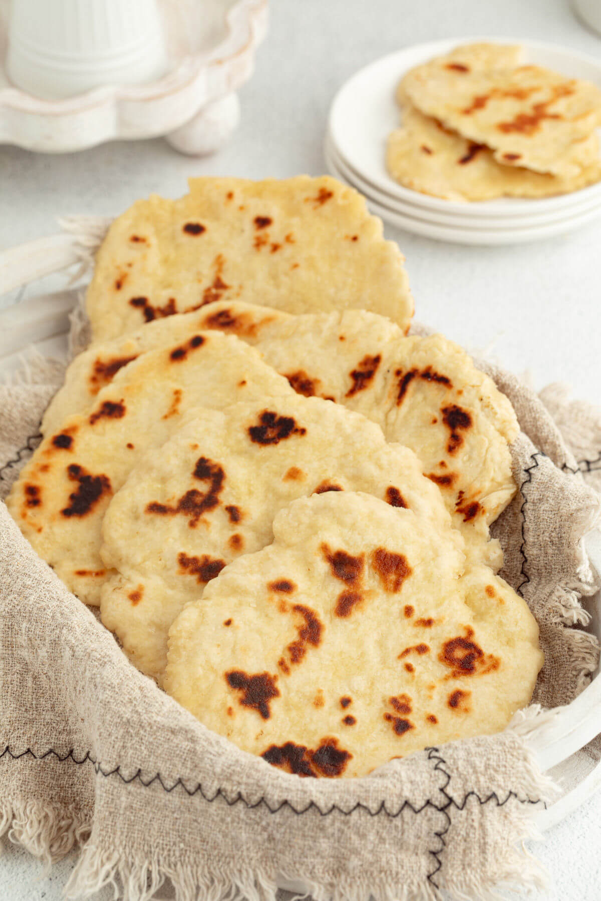 Sourdough naan in a bread basket.