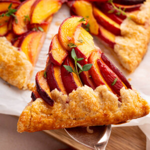 Sourdough peach galette on a serving spoon.
