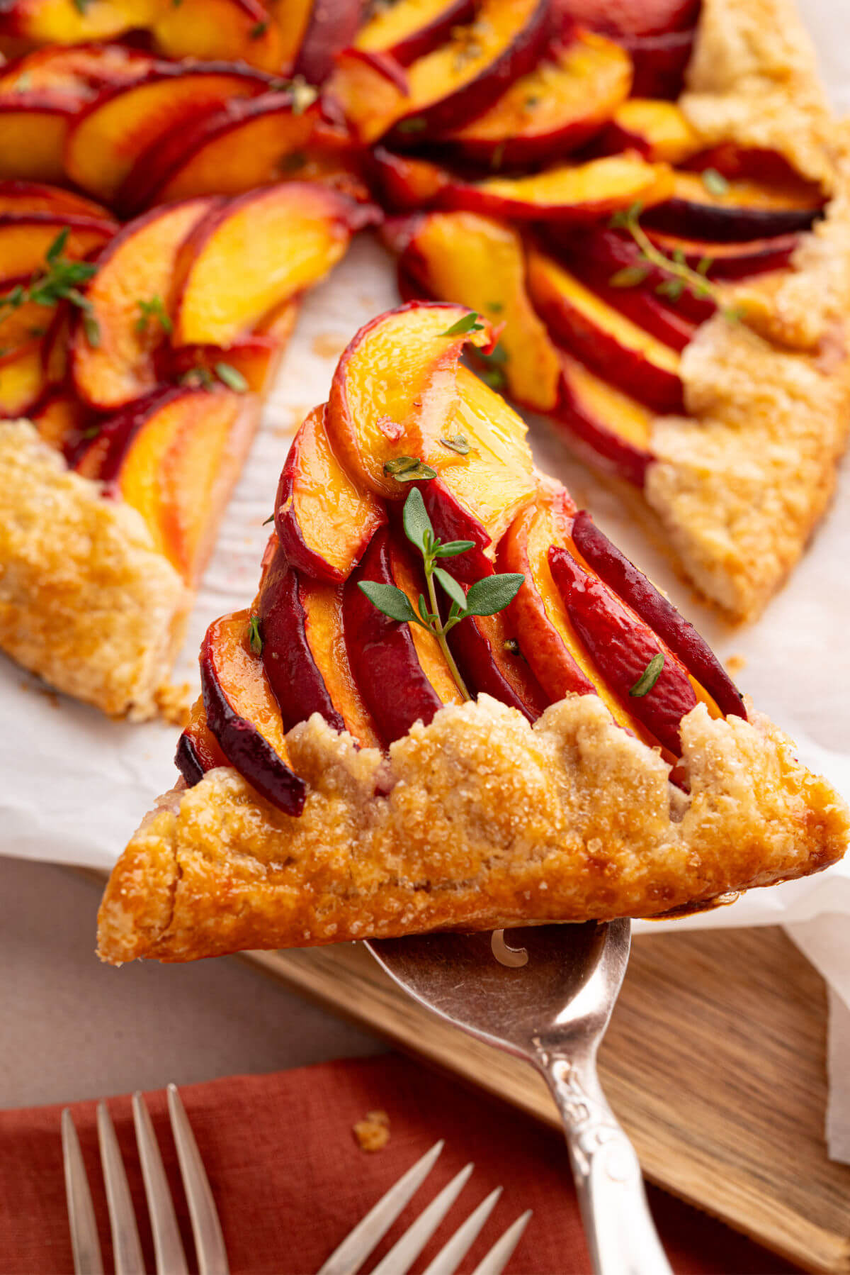 Sourdough peach galette on a serving spoon.