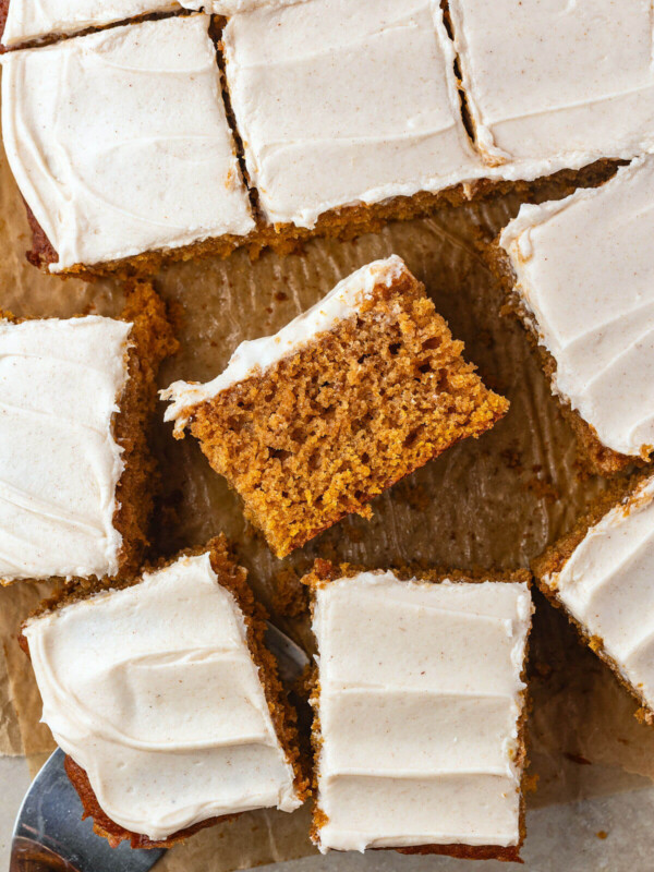 Sourdough pumpkin bars cut into bars and frosted with cream cheese frosting.