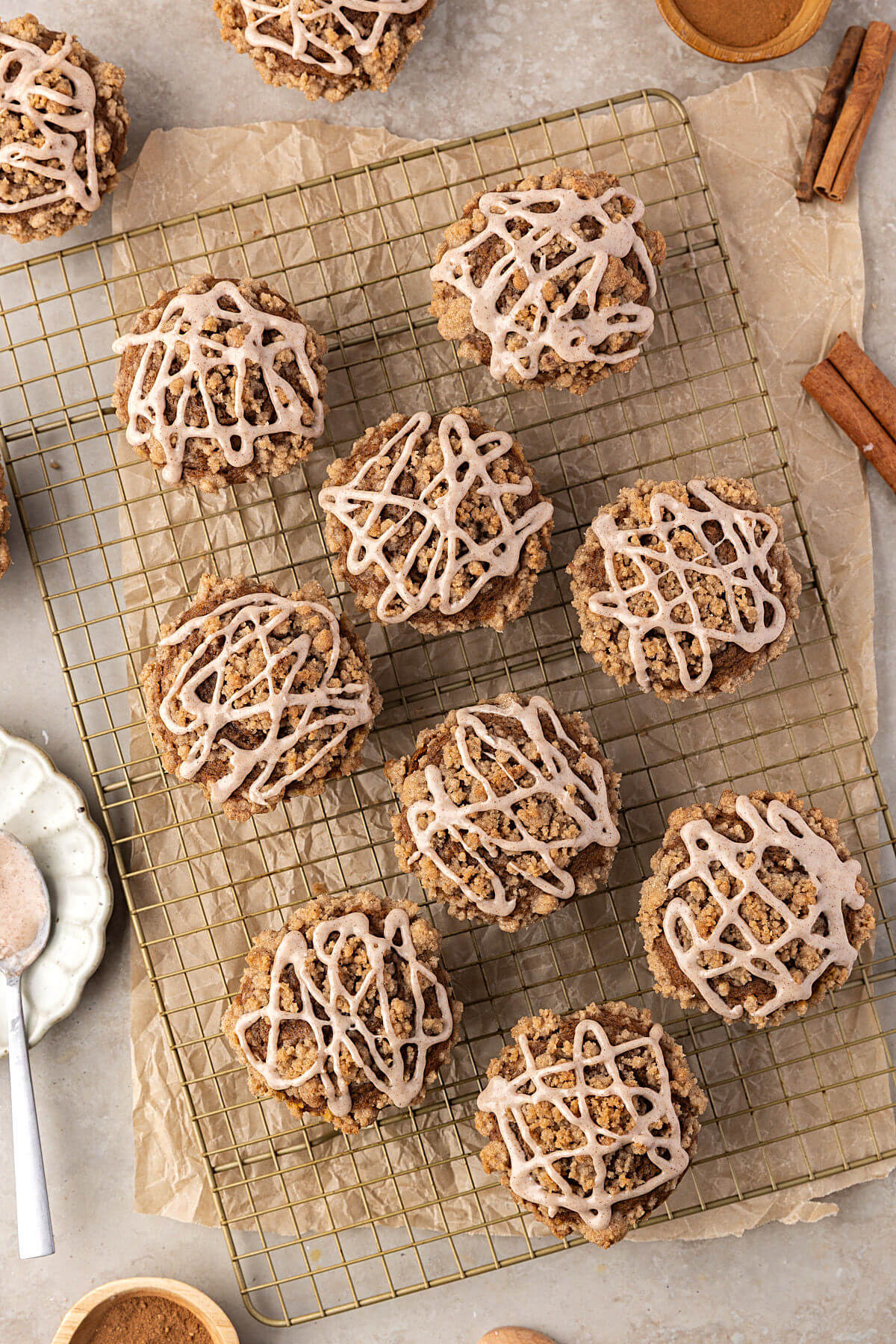 Sourdough pumpkin muffins on a wire cooling rack.