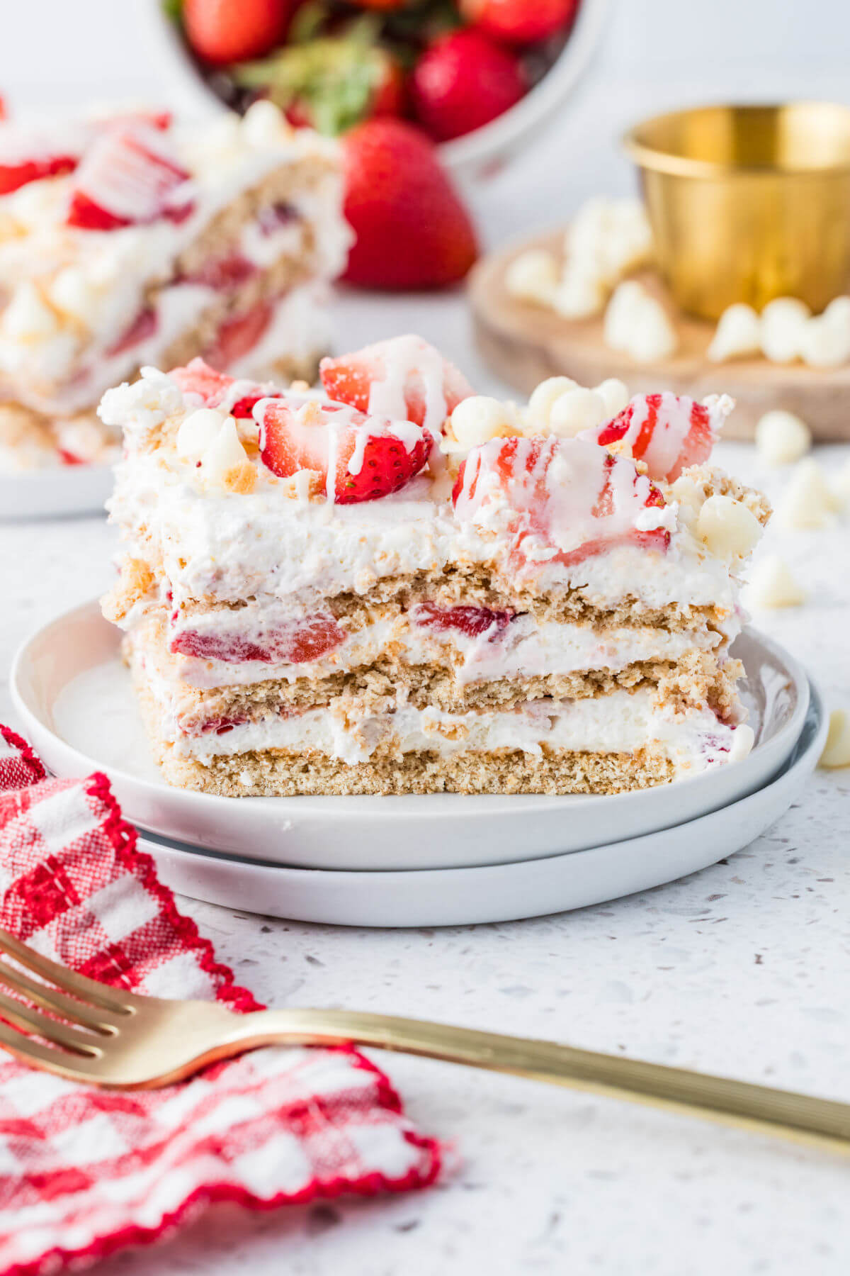 Piece of strawberry icebox cake on a serving plate.