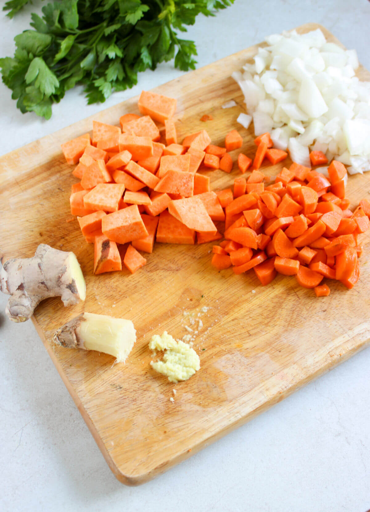 Vegetables cut up on a cutting board.