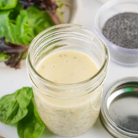 Homemade poppy seed dressing in a glass jar.