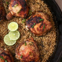 Jerk chicken and rice recipe in a cast iron skillet.