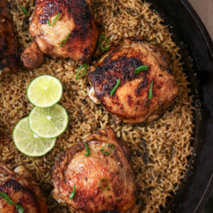 Jerk chicken and rice recipe in a cast iron skillet.