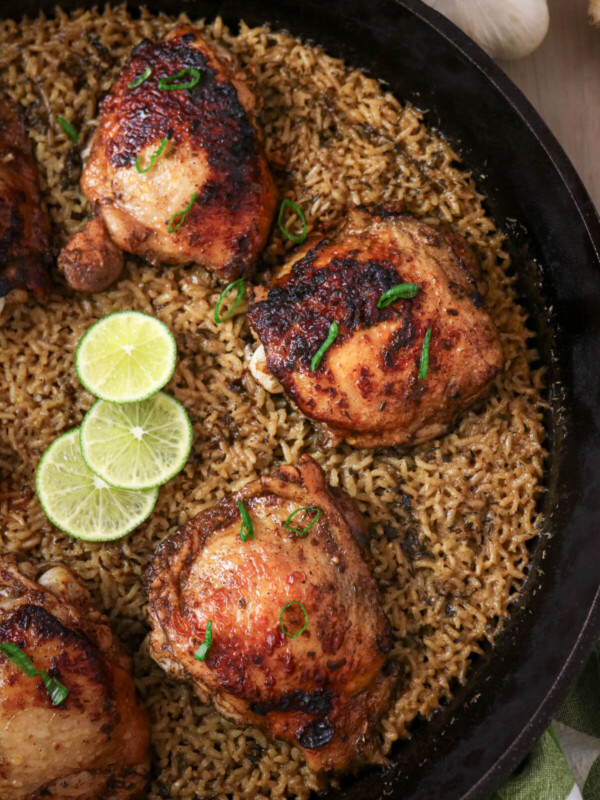 Jerk chicken and rice recipe in a cast iron skillet.
