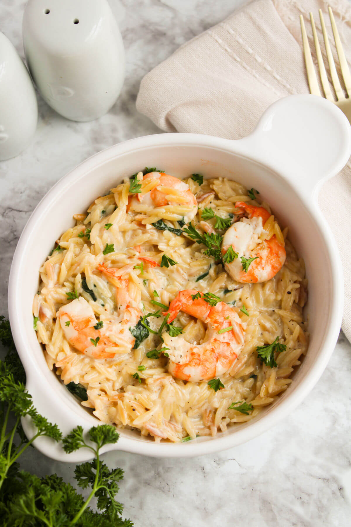 Lemon garlic shrimp orzo in a serving bowl.