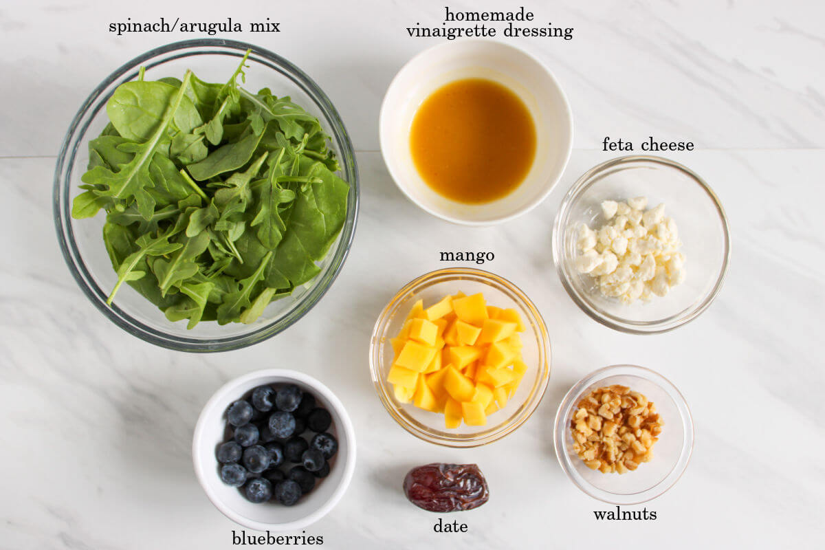 Ingredients used for a mango blueberry salad.