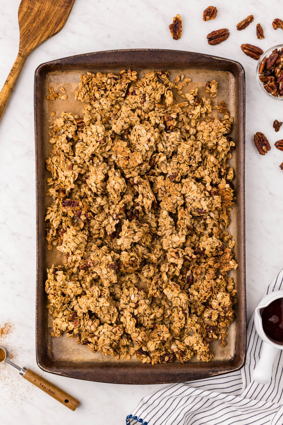 Maple granola recipe on a cookie sheet.