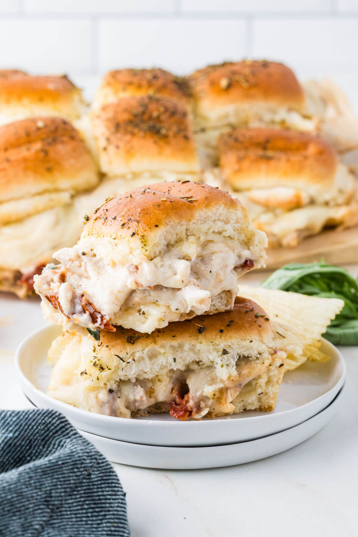 Marry me chicken sliders on serving plates.