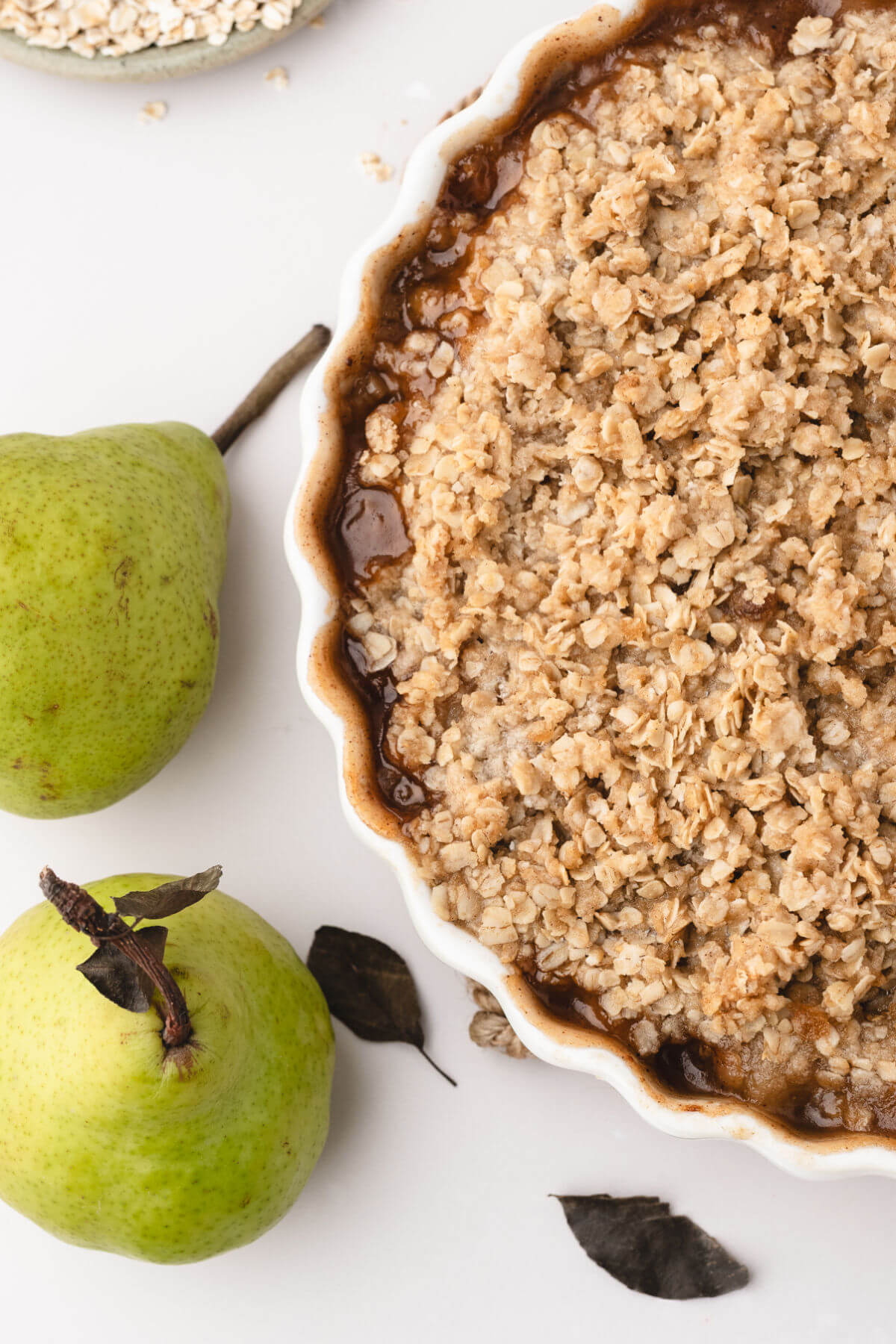 Easy pear crisp in a round baking dish.