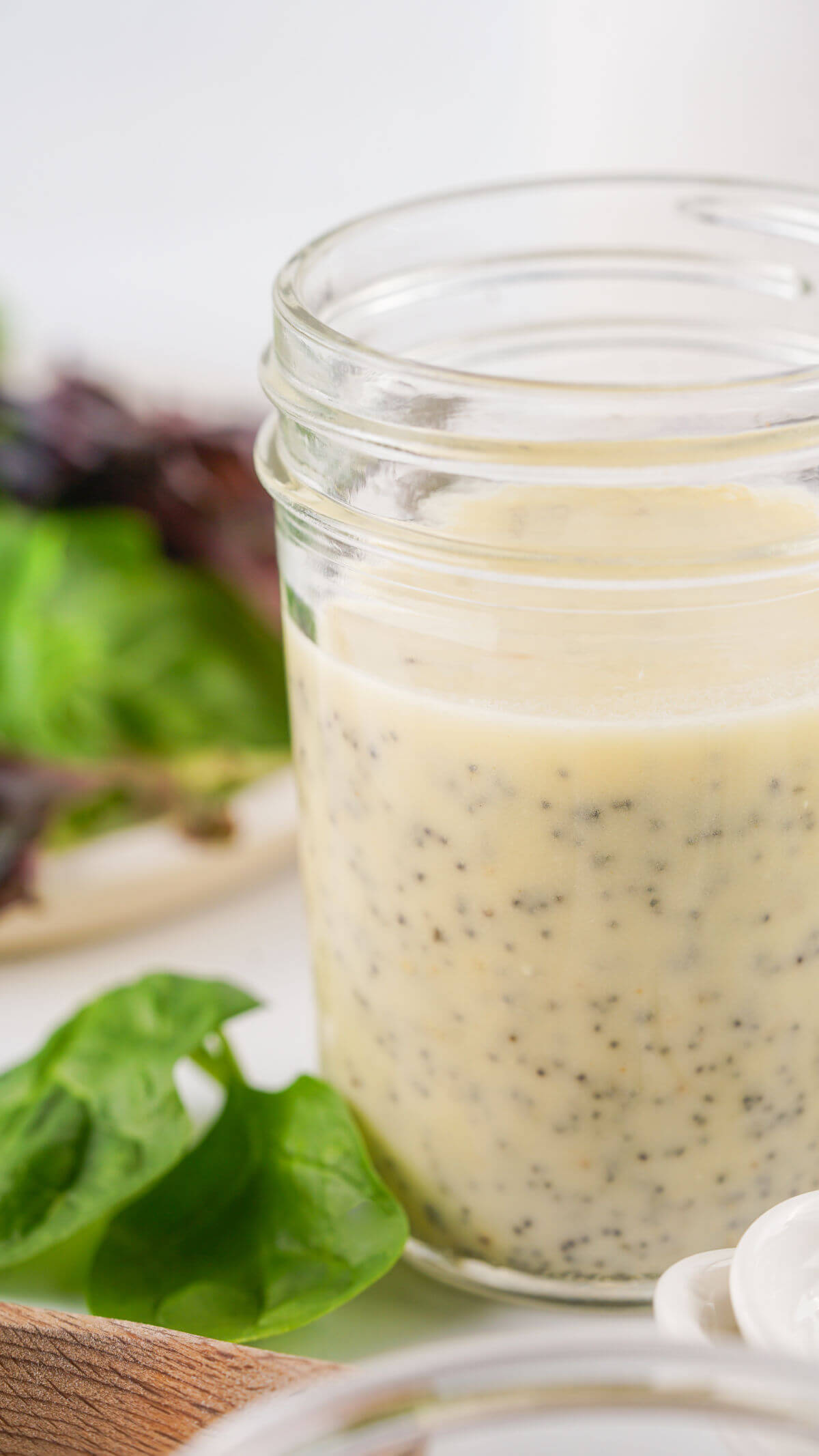 Homemade poppy seed dressing in a jar.