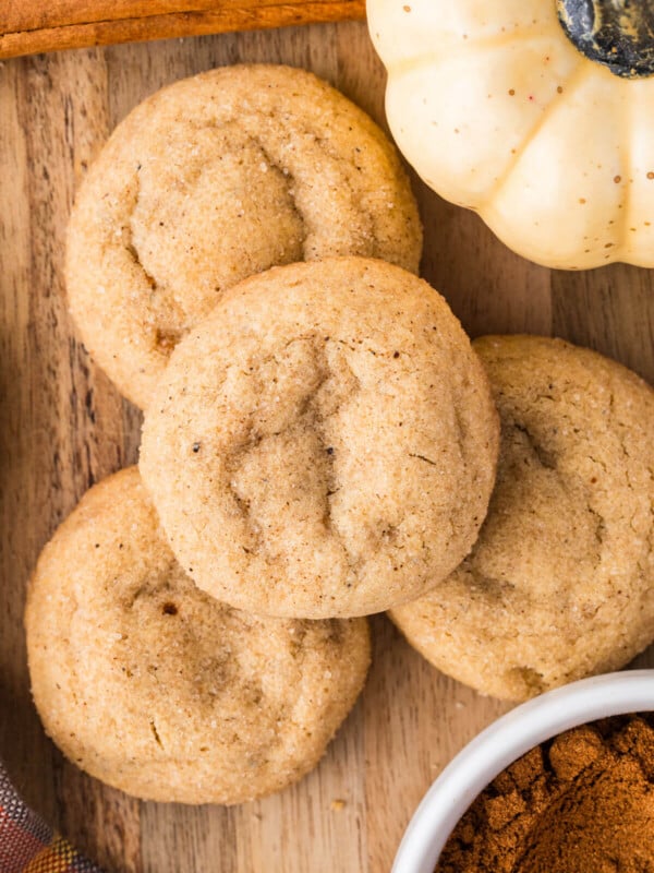 Pumpkin pie spice cookies on a wooden board.