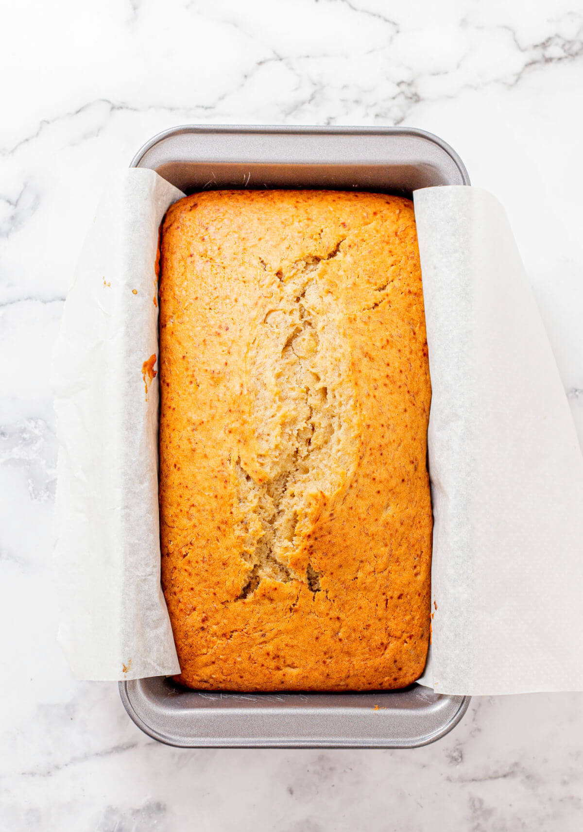 Quick and easy banana bread in bread pan after baking.