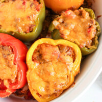 Quinoa stuffed peppers in a baking dish.