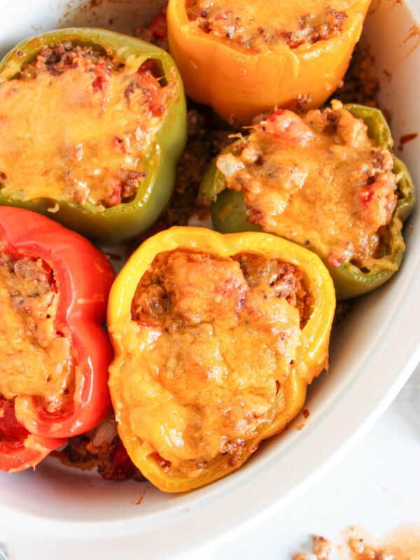 Quinoa stuffed peppers in a baking dish.