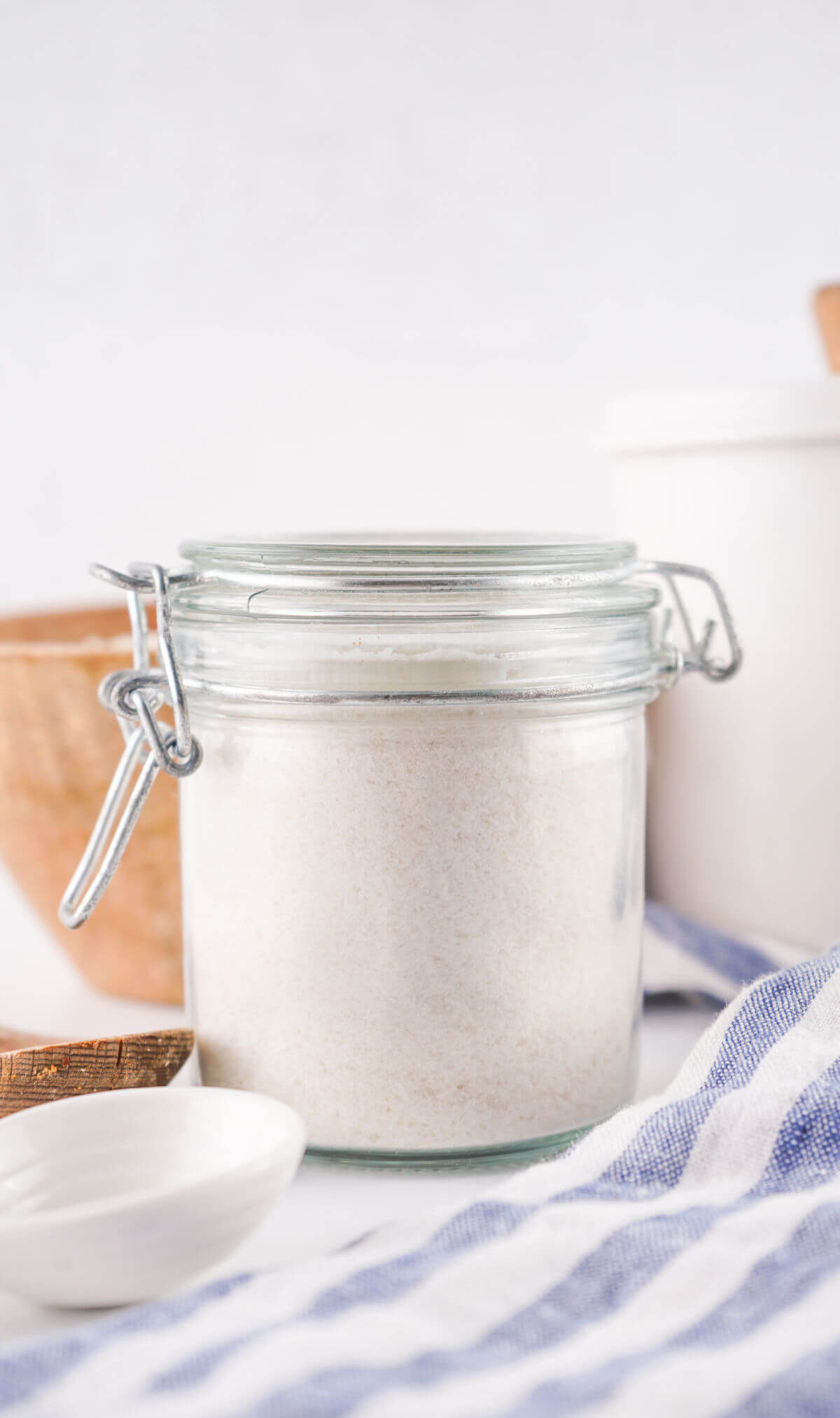 Homemade rice flour in a glass jar.