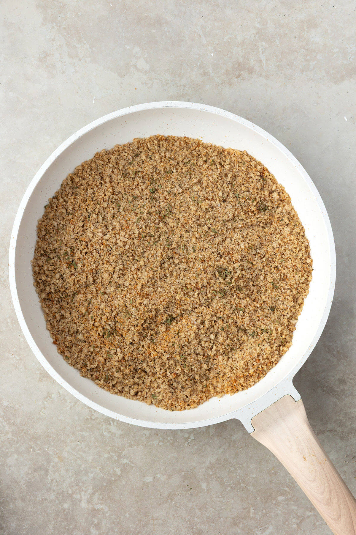 Homemade breadcrumbs in a skillet.