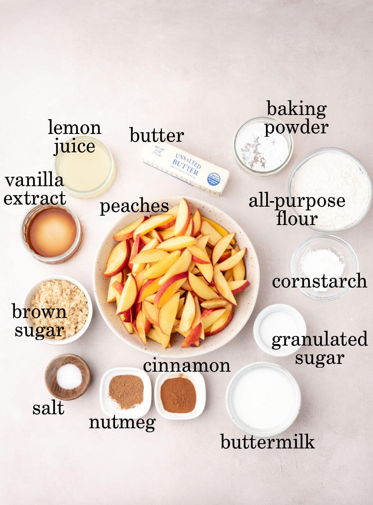 Ingredients for skillet peach cobbler in small bowls.