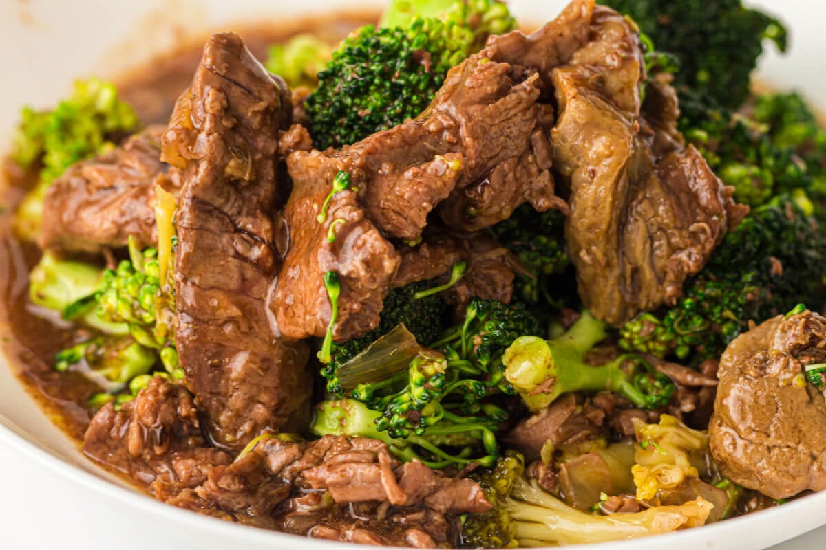 Slow cooker beef and broccoli in a serving bowl.