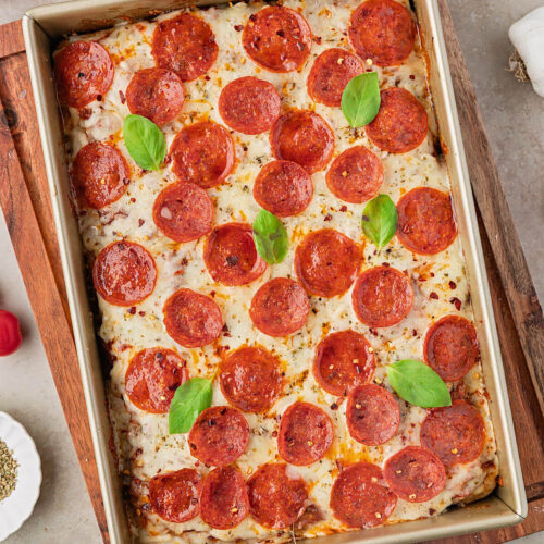 Sourdough discard focaccia pizza in a baking dish.