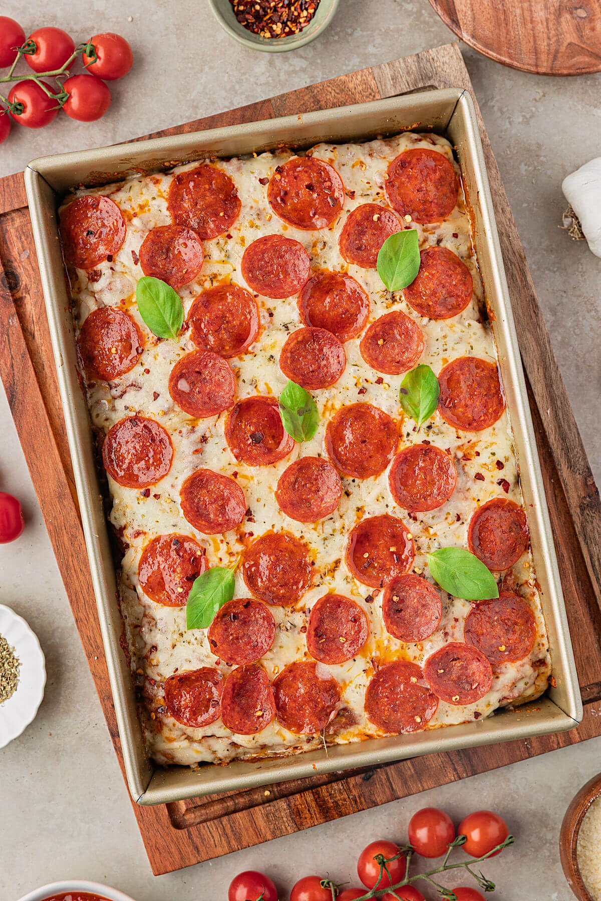 Sourdough discard focaccia pizza in a baking dish.