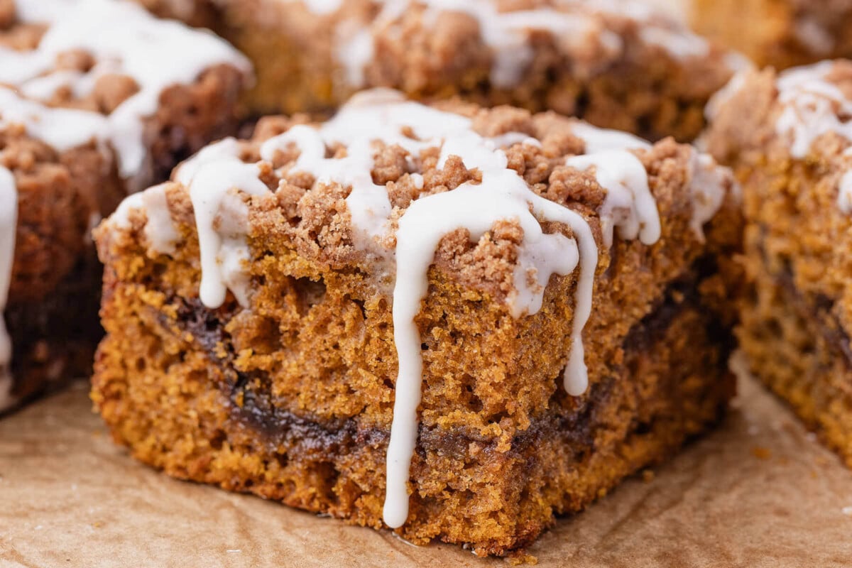Sourdough pumpkin coffee cake with drizzle on top.