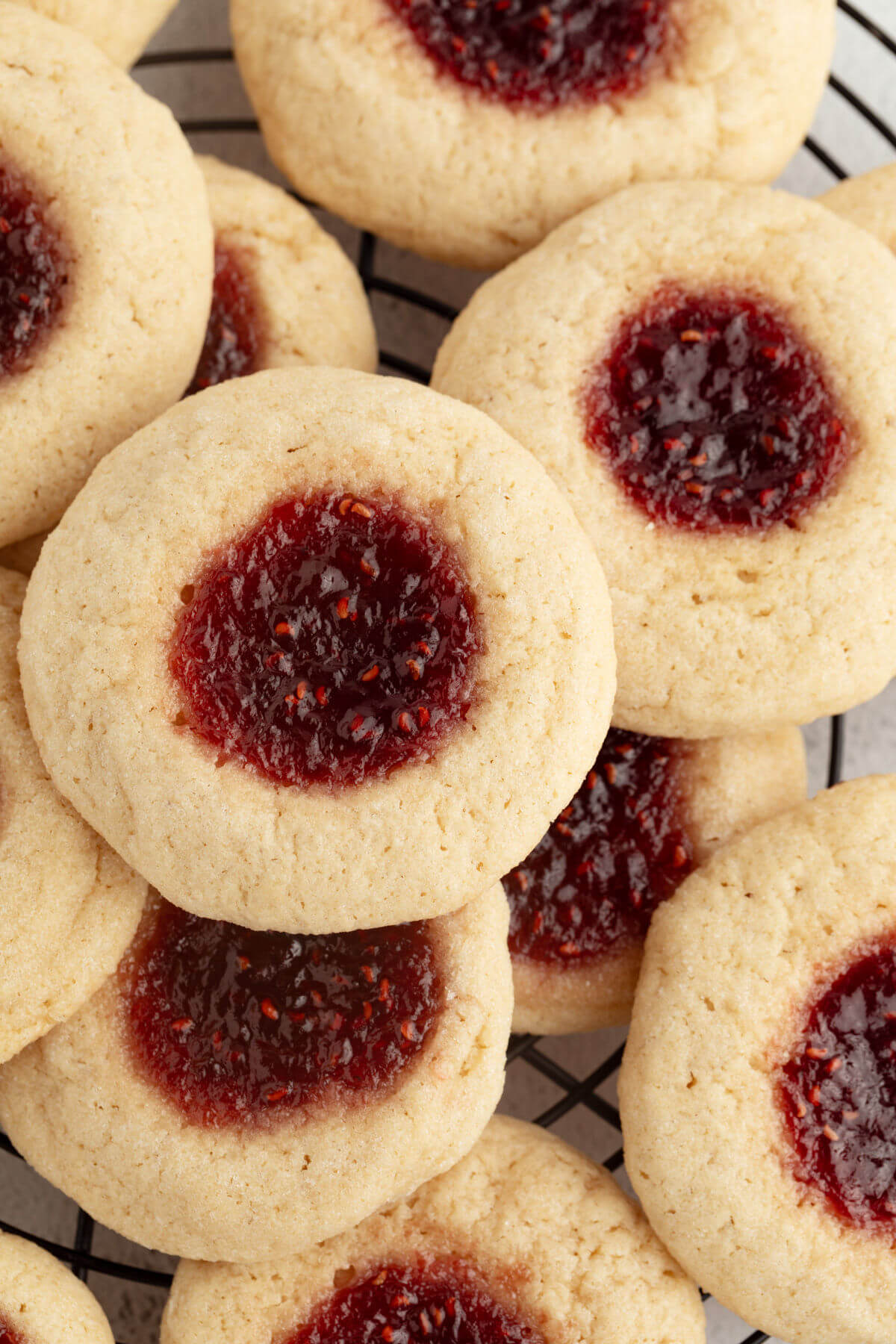 Sourdough thumbprint cookies on a cooling rack.