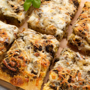 Sourdough focaccia pizza bianca cut into serving pieces.