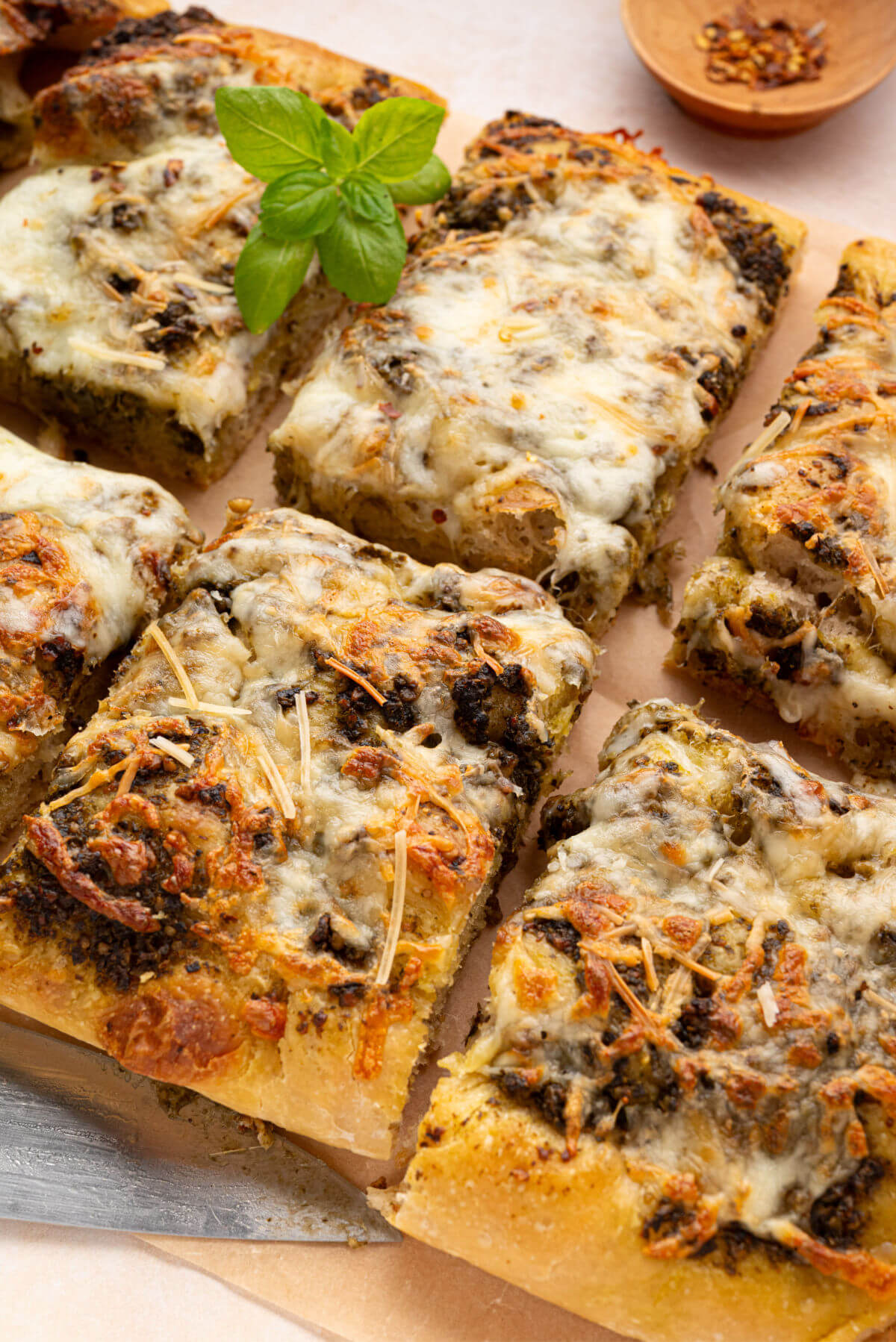 Sourdough focaccia pizza bianca cut into serving pieces.