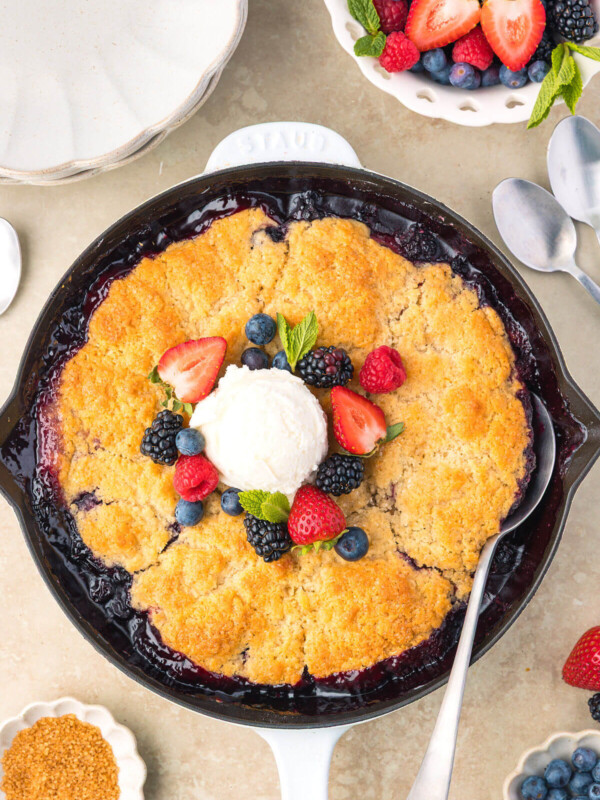Sourdough mixed berry cobbler in a cast iron skillet after baking.