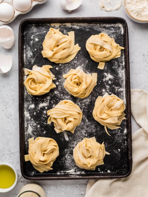 Sourdough pasta recipe on a baking sheet to dry.