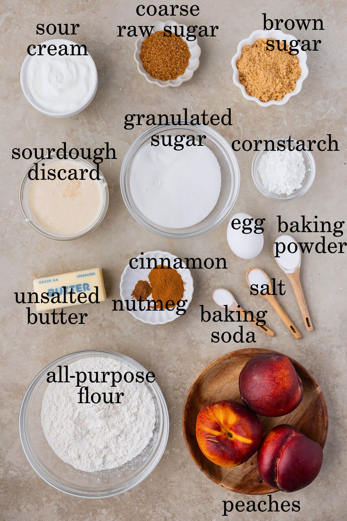 Ingredients for sourdough peach cobbler in small bowls.
